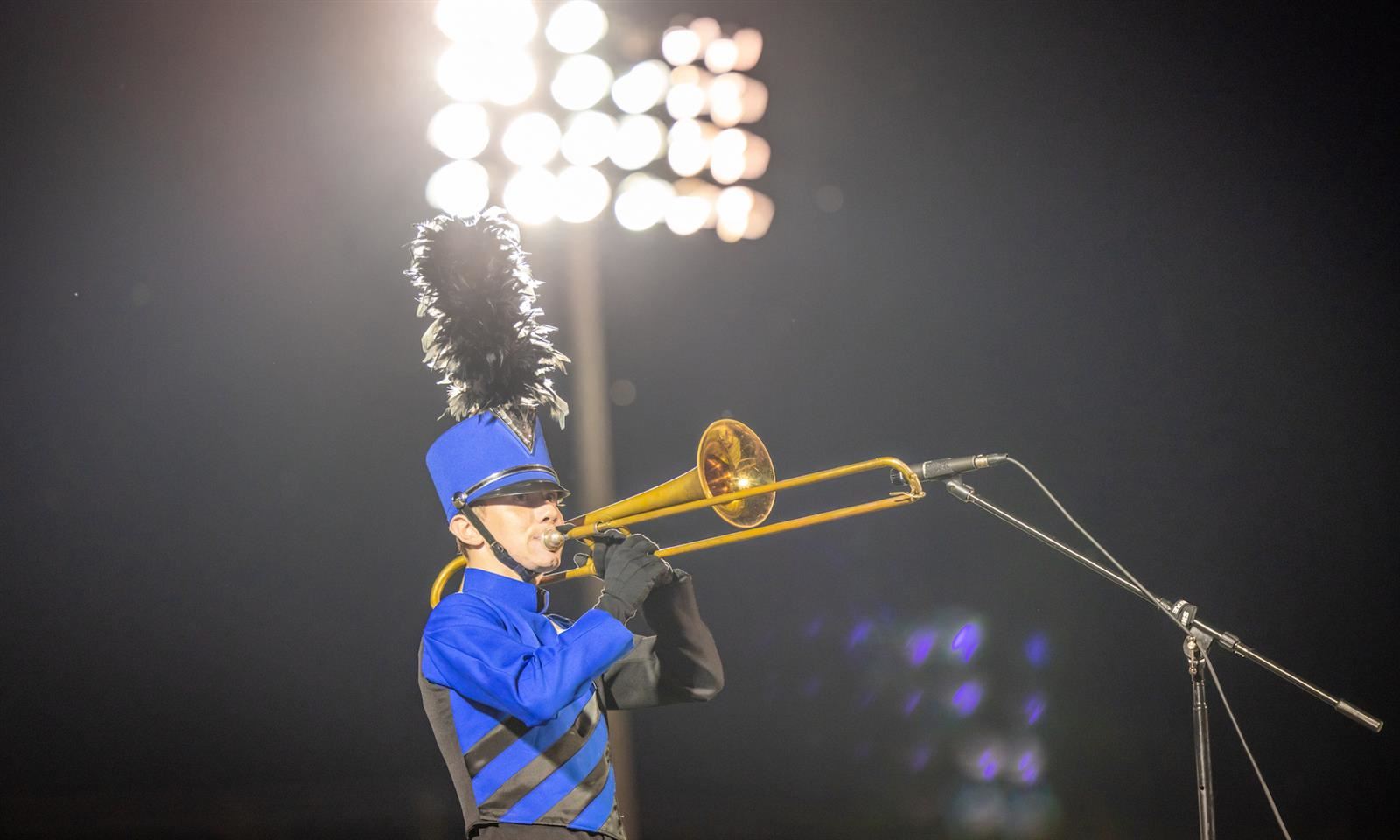 A boy plays the trumpet